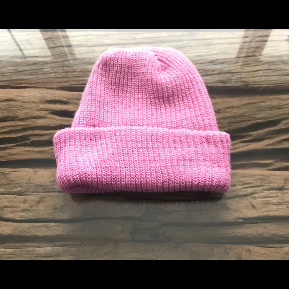 Winter hat. Pink color. Knitted hat.